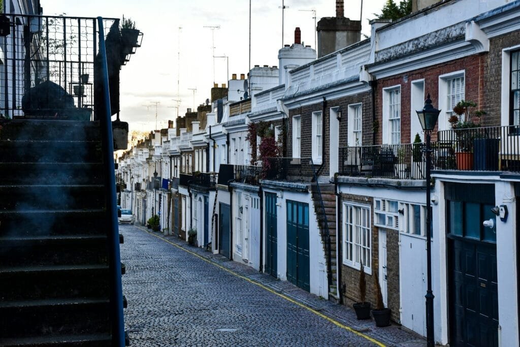 a row of houses on a cobblestone street